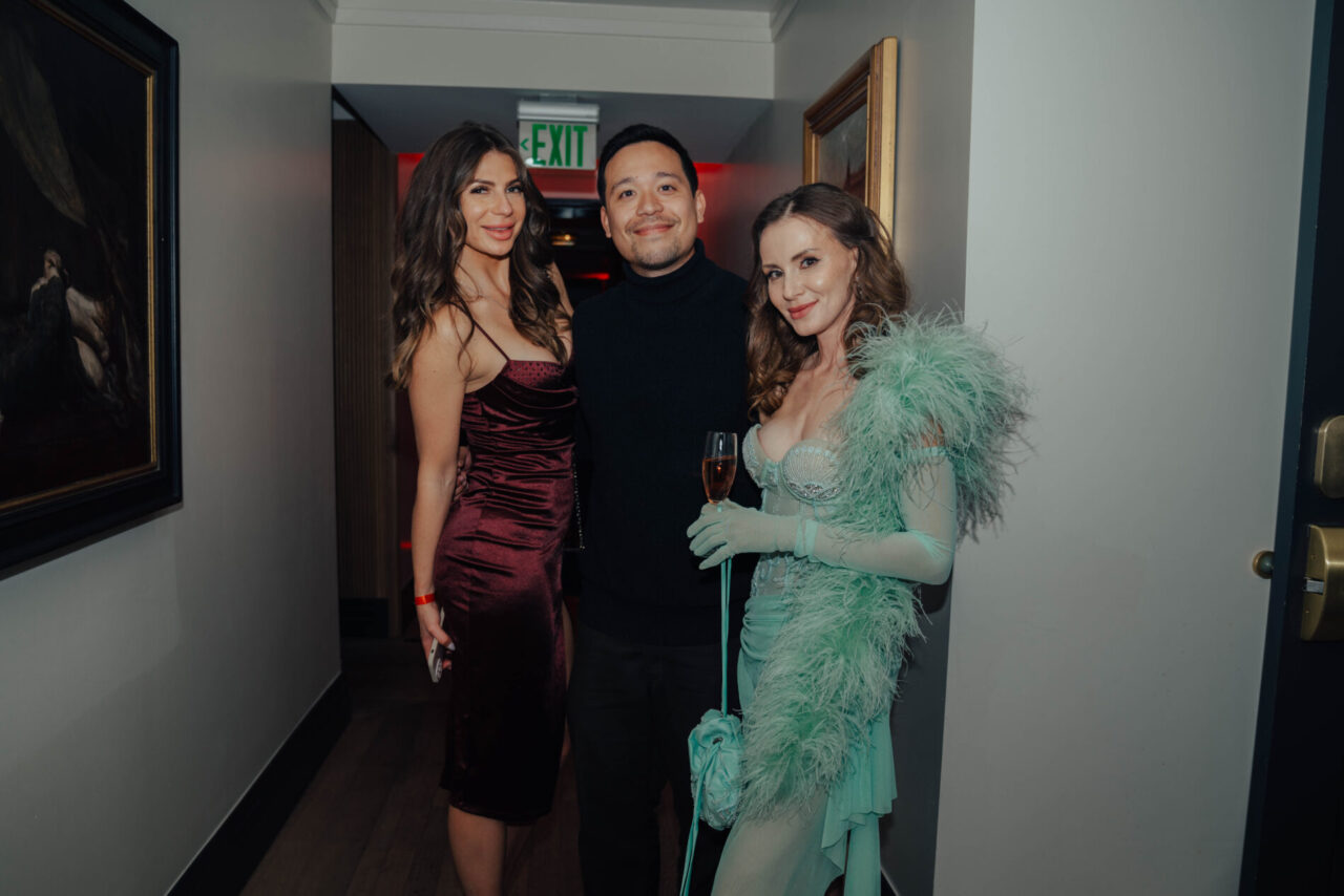 A man and two women dressed up for an event at our Denver social club
